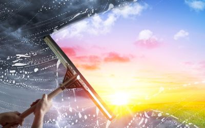 Graphic of cleaning a foreboding window to reveal a beautiful, utopian scene to illustrate the article Utopia vs. Dystopia